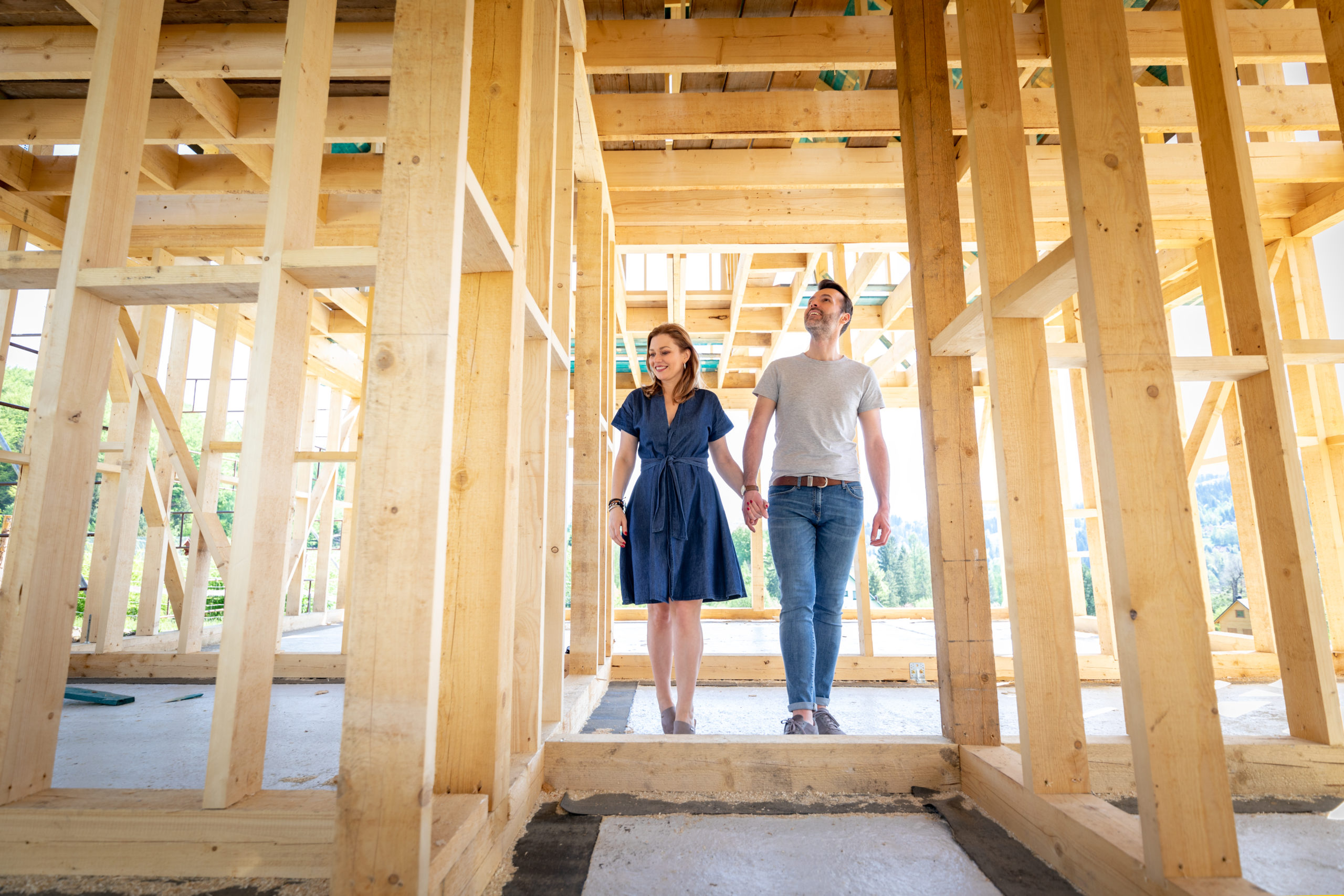 Loving couple at construction site of their new home dreams come true